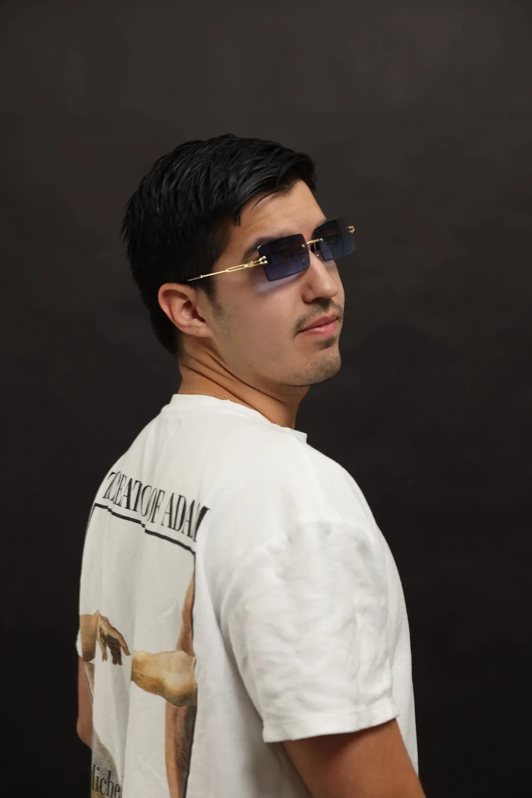 Portrait of Azul in sunglasses, looking back over the shoulder